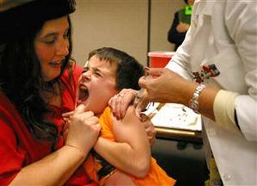administering flu vaccine is painful for kids