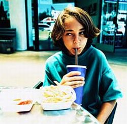 teen boy drinking soda